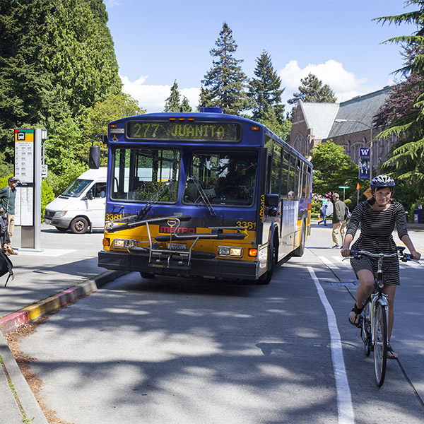 metro king county bus and bicyclist on stevens way